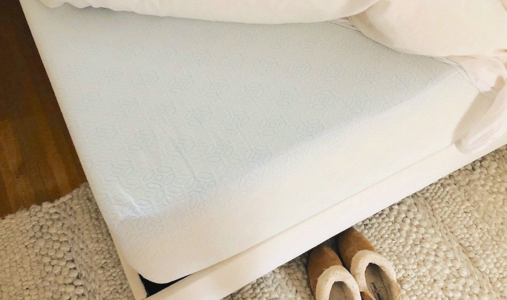 corner of white memory foam mattress