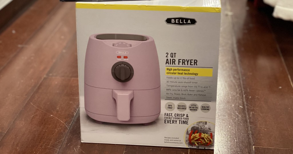 pink air fryer in box on store floor