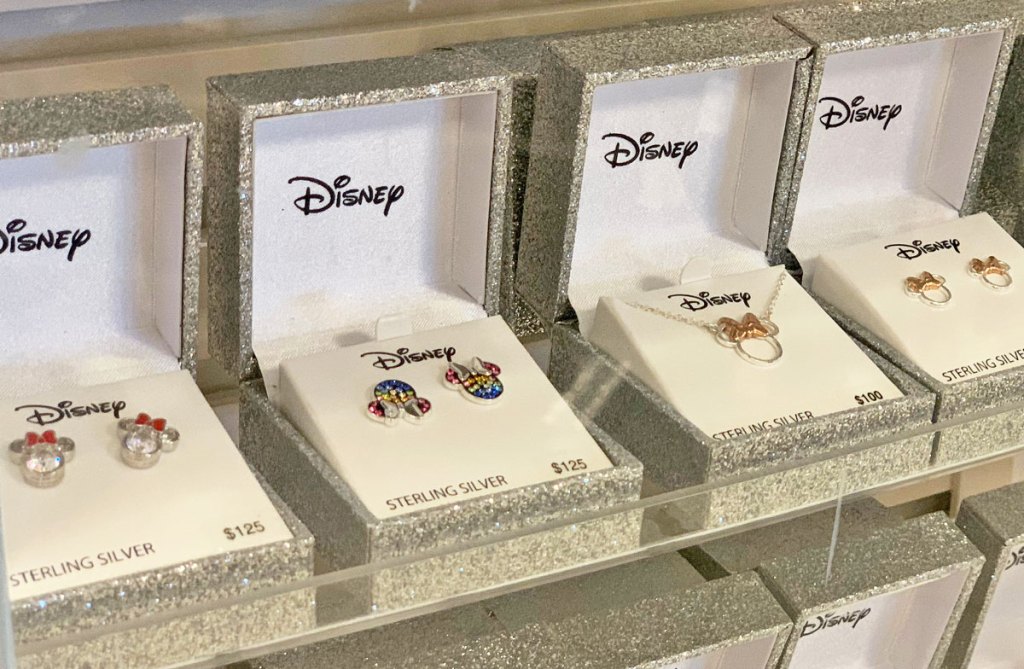 various disney minnie and mickey mouse shaped earrings and necklaces in sparkly silver jewelry boxes