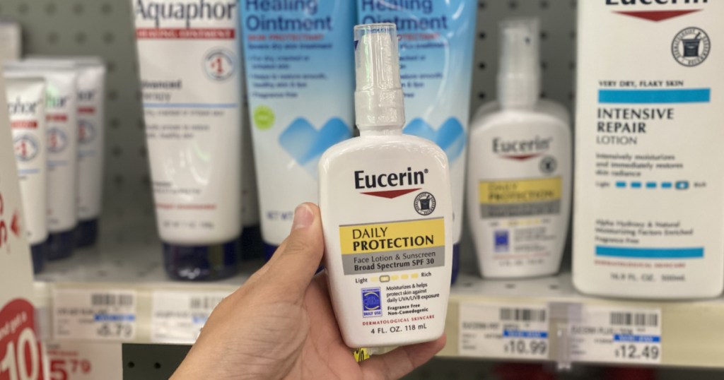 hand holding eucerin lotion 