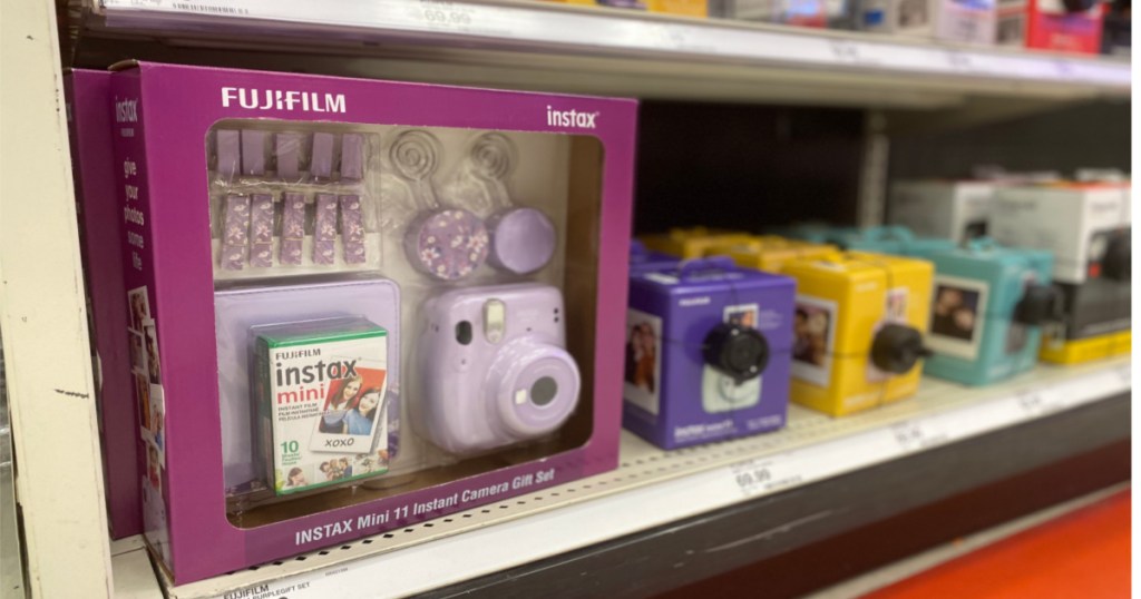 insant cameras sitting on shelf 