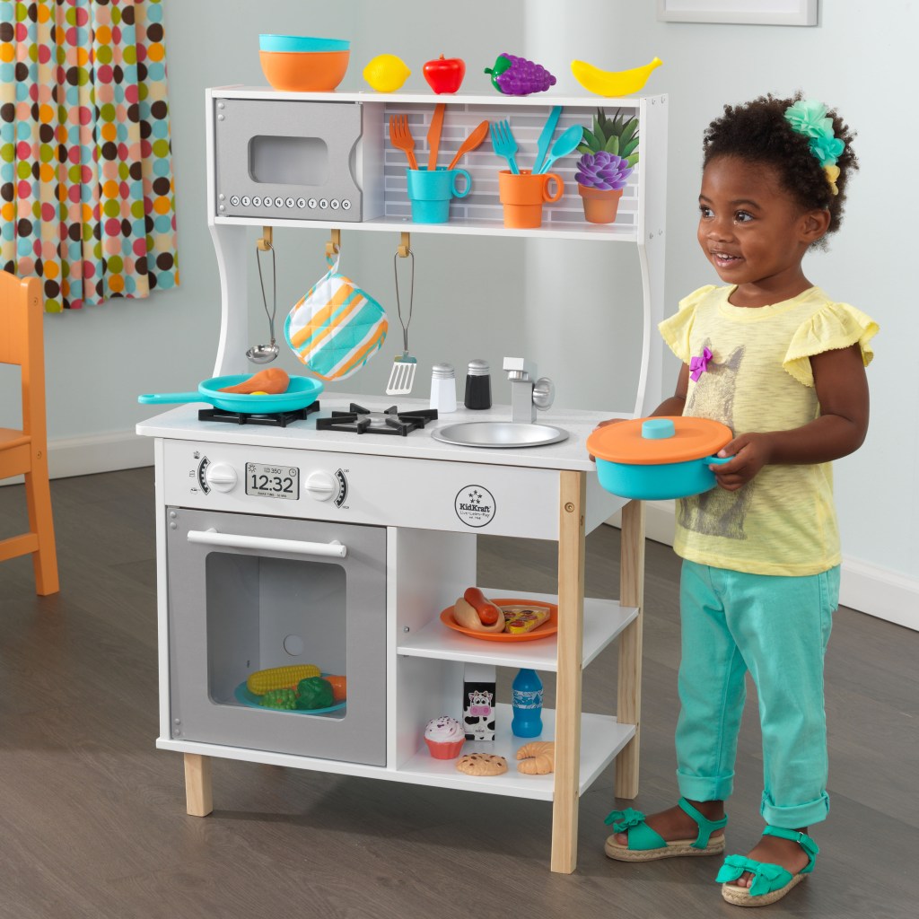 Girl with Kidkraft all Time Play Kitchen