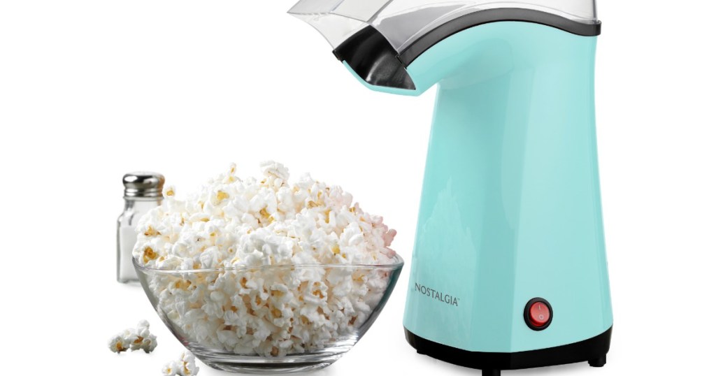 Nostalgia Popcorn Maker in blue next to bowl of popcorn