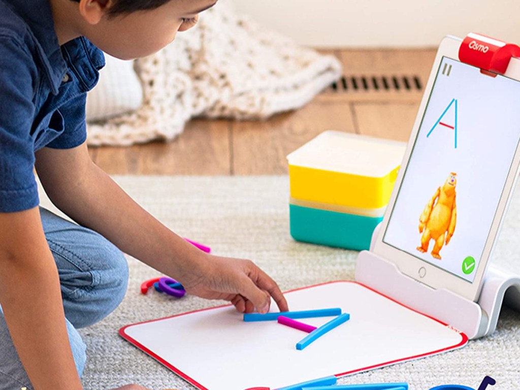 child creating letter a with sticks using Osmo Little Genius Starter Kit for iPad