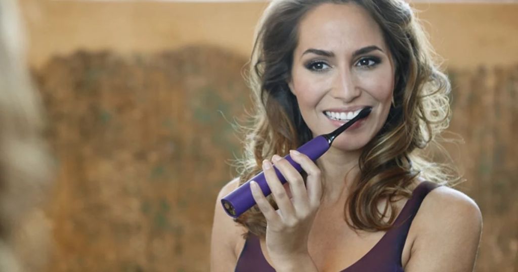 woman brushing her teeth