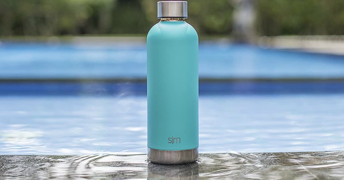 Simple Modern 17oz Stainless Steel Sports Water Bottle in teal near a pool