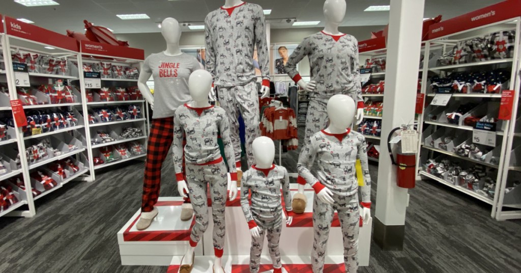 mannequins wearing holiday pajamas in store