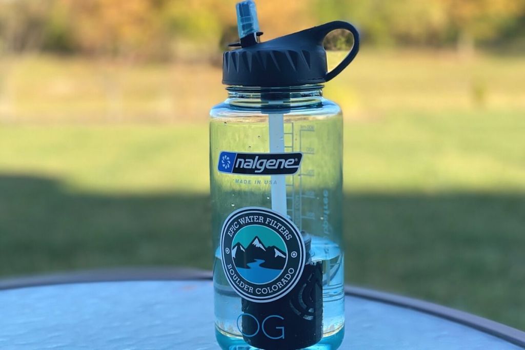 A reusable water bottle on a table outside