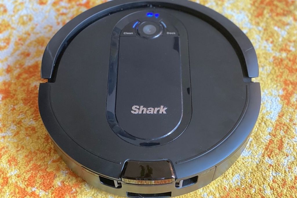 A robot vacuum on a rug