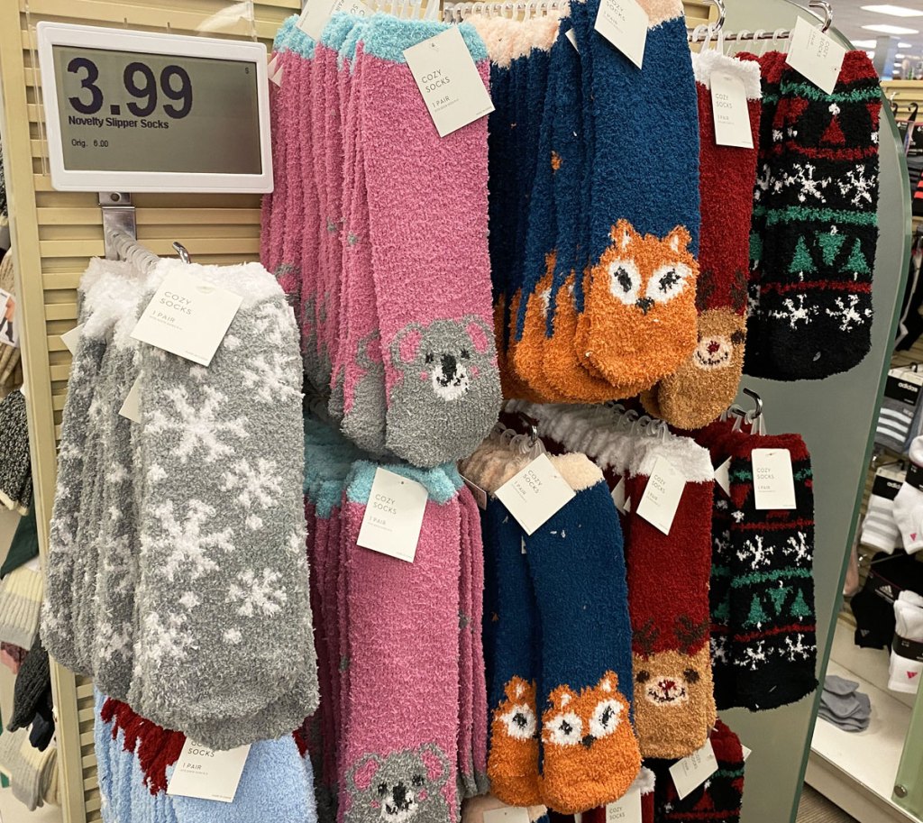 pairs of fuzzy socks with animals at tips of toes hanging on display at kohl's