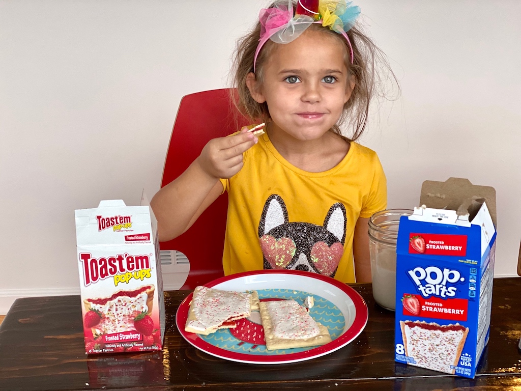 little girl taste testing Dollar Tree food 