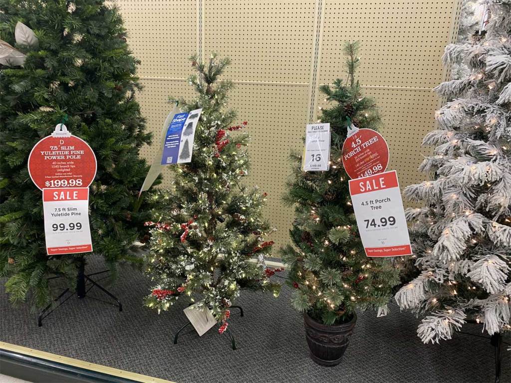 christmas trees on display in a store