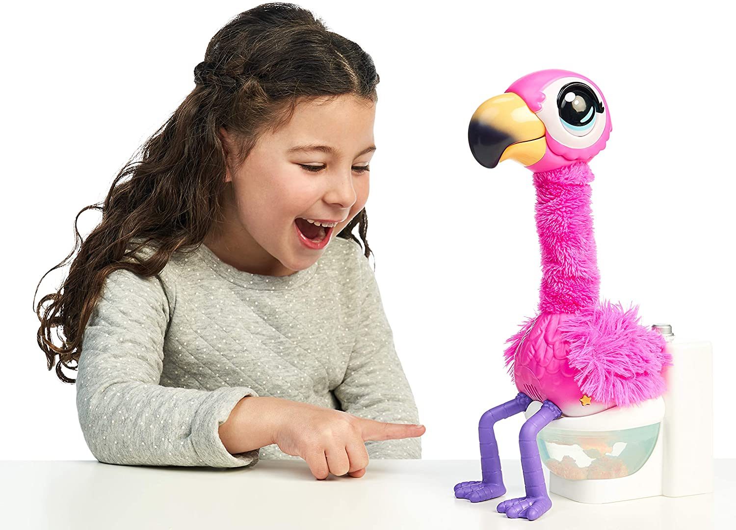 little girl playing with gotta go flamingo