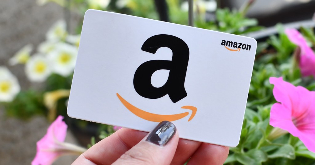 hand holding amazon gift card for amazon prime day