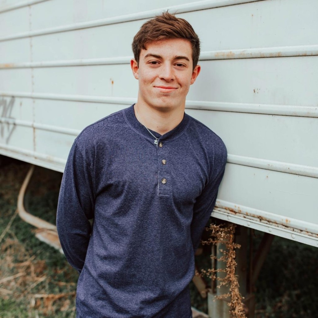 man wearing navy henley shirt