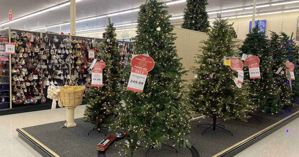 christmas trees on display in a store