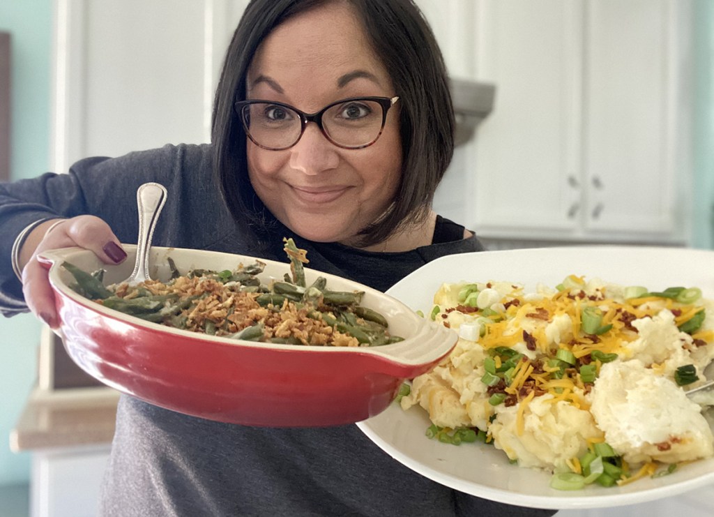 woman holding home chef thanksgiving sides
