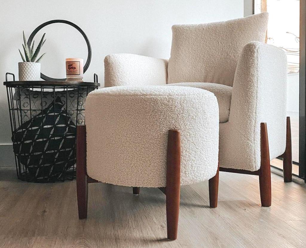 sherpa chair and ottoman sitting on wood floor