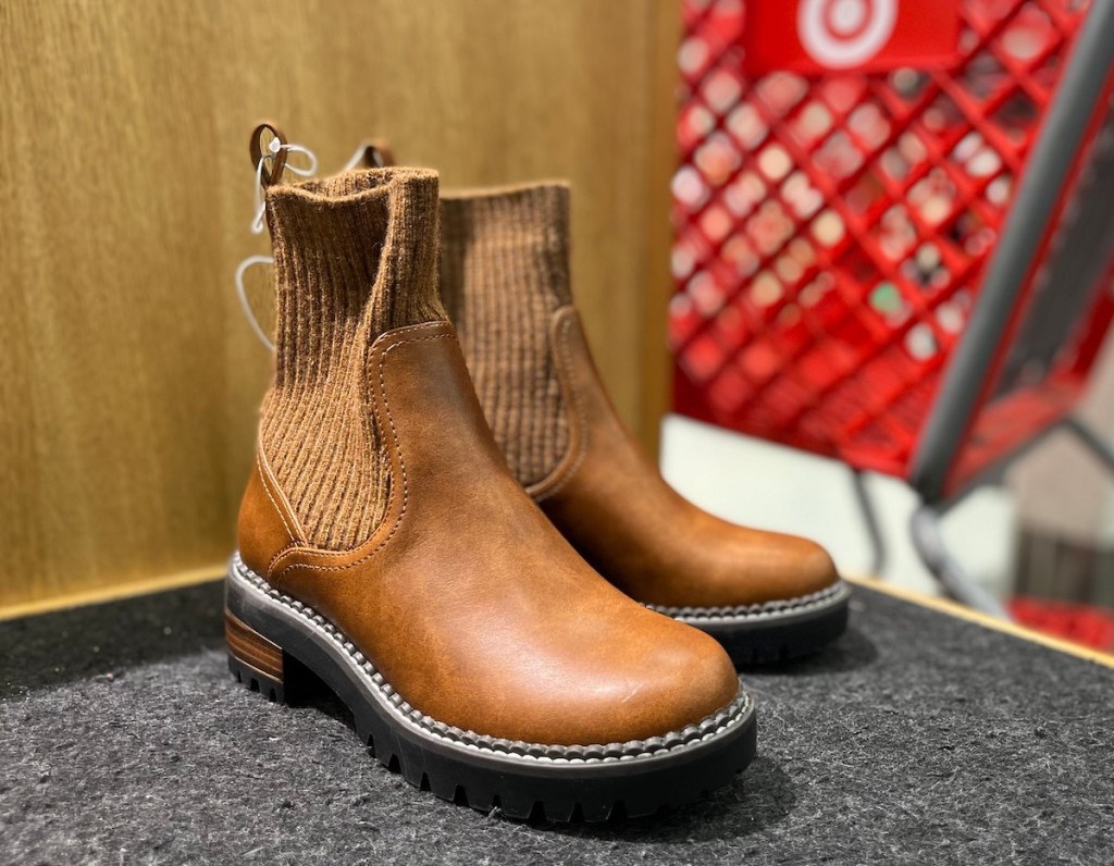 close up of pair of brown sock boots on store display