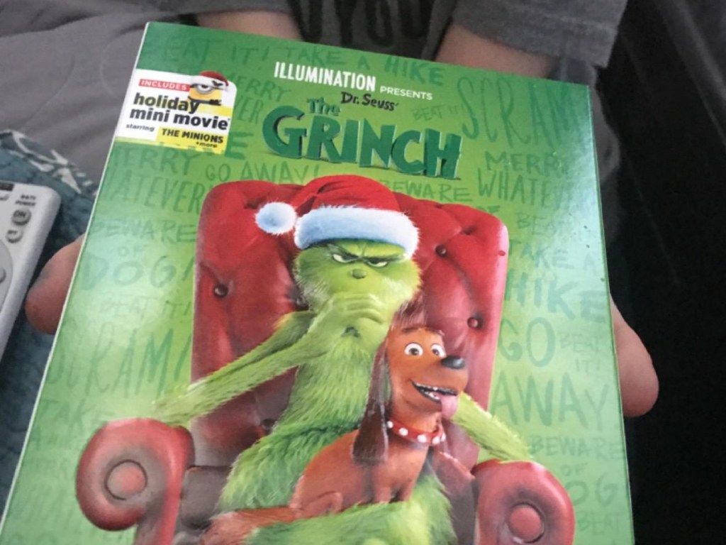 the grinch dvd in hand