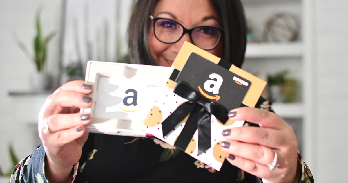 woman holding amazon gift cards