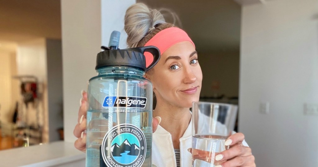 woman holding Epic Nalgene water bottle with filter 