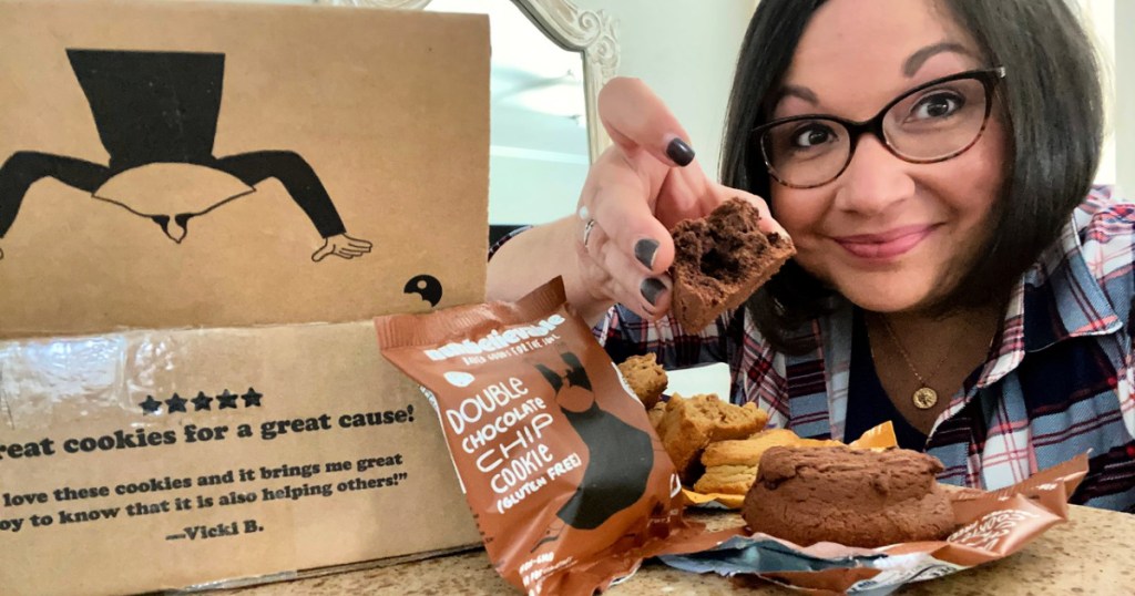 woman holding nunbelievable cookie