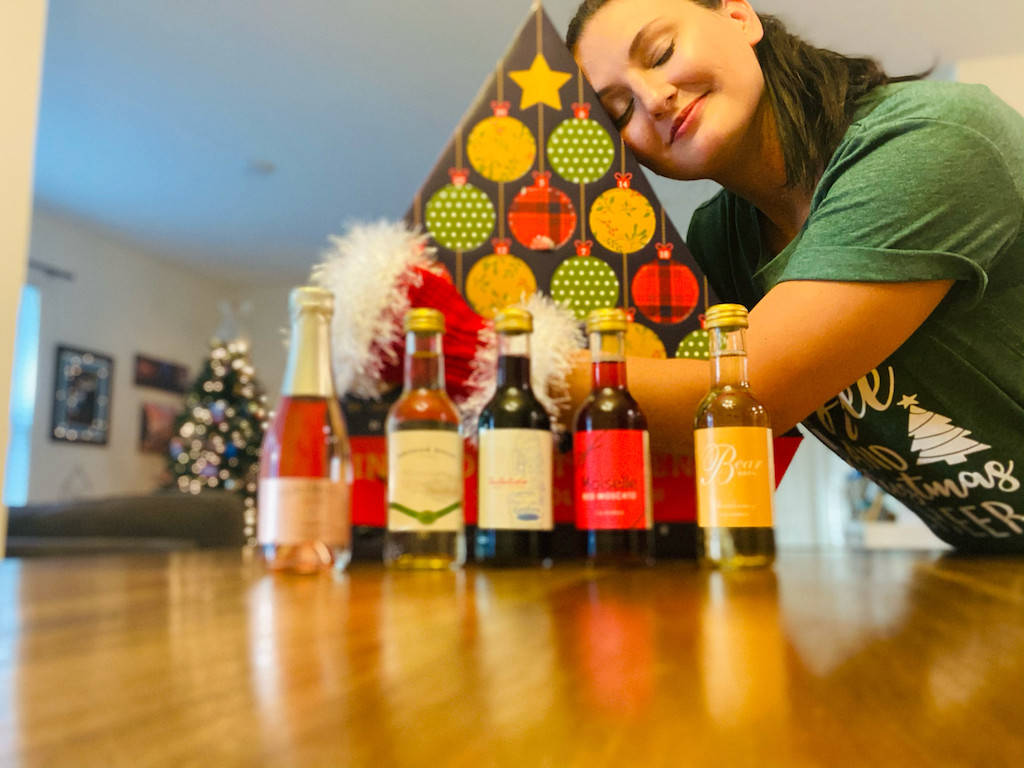 woman hugging wine advent calendar from ALDI