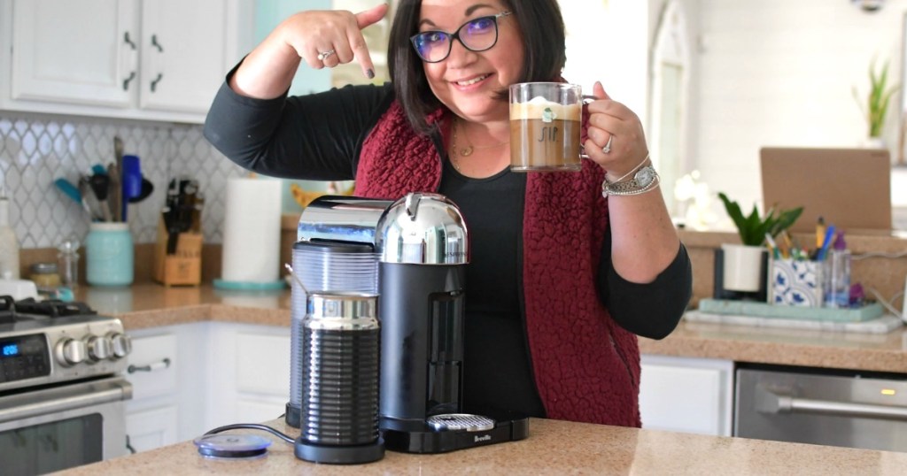 woman pointing at espresso machine 