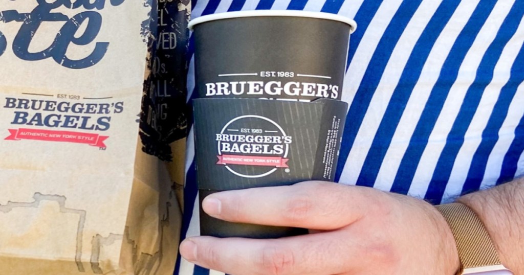 Man's hand holding a cup of coffee