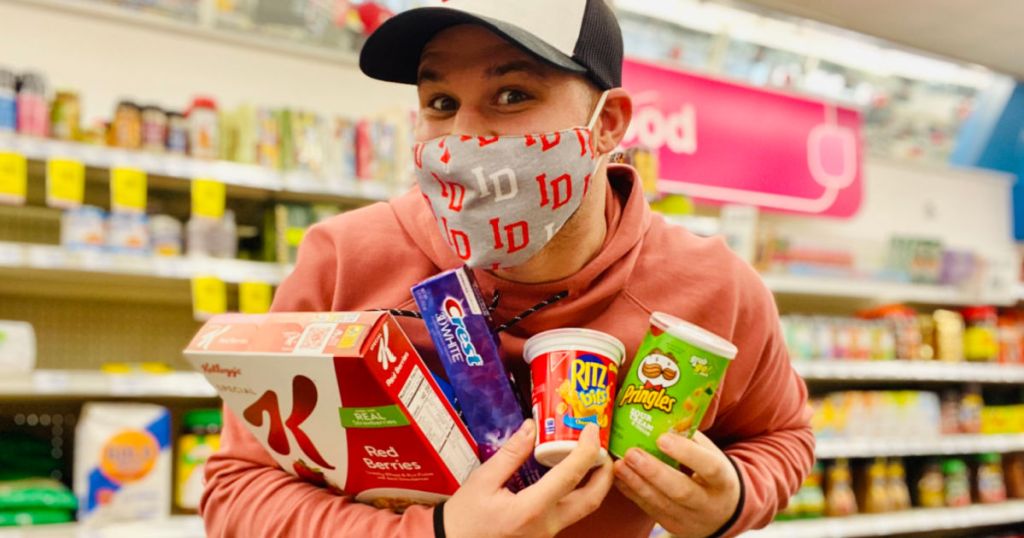 man holding grocery items 