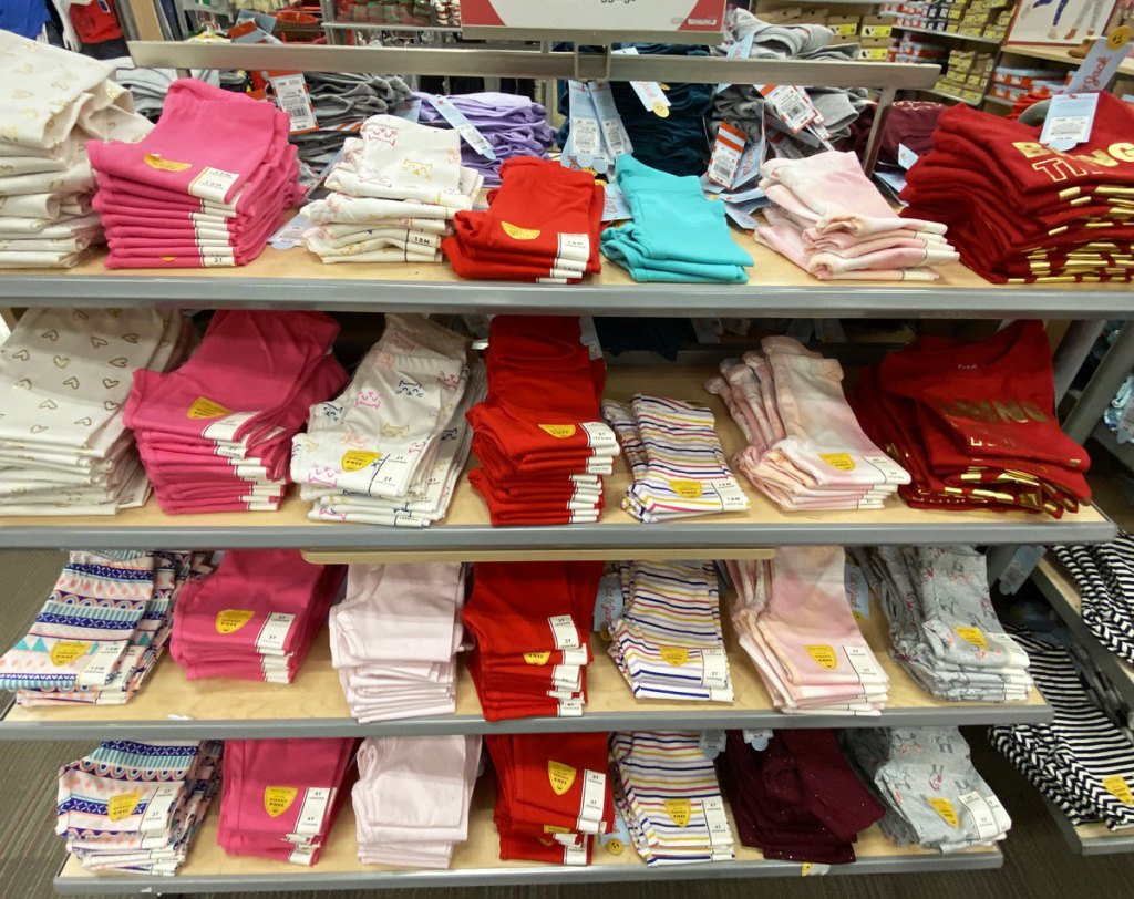 store display shelves full of folded pairs of cat & jack girls leggings in various colors