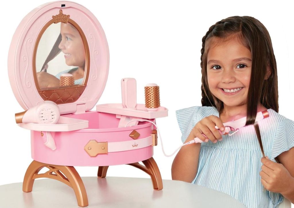 girl styling her hair with toy curler