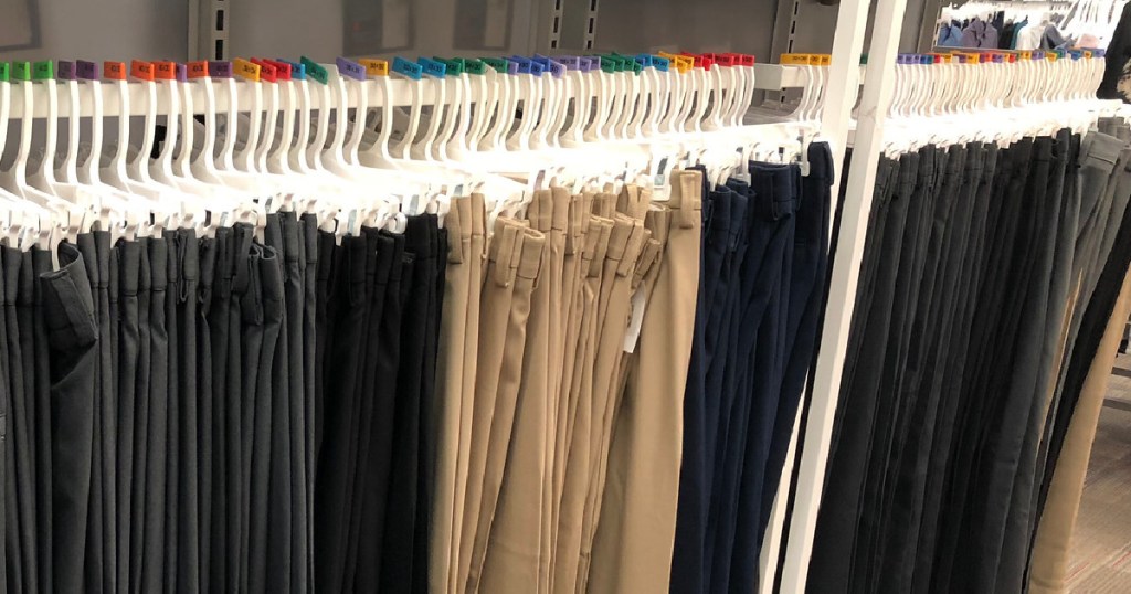 haggar men's pants hanging on a rack in store