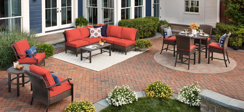 large patio with couch, table and chairs