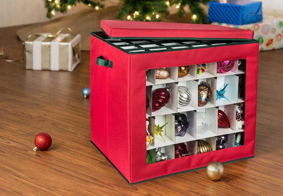 Honey-Can-Do Small Ornament Storage Cube with ornaments in it sitting by a Christmas tree 