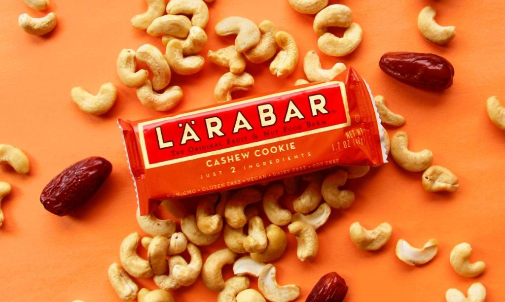 Larabar Cashew Cookie surrounded by cashews and dates