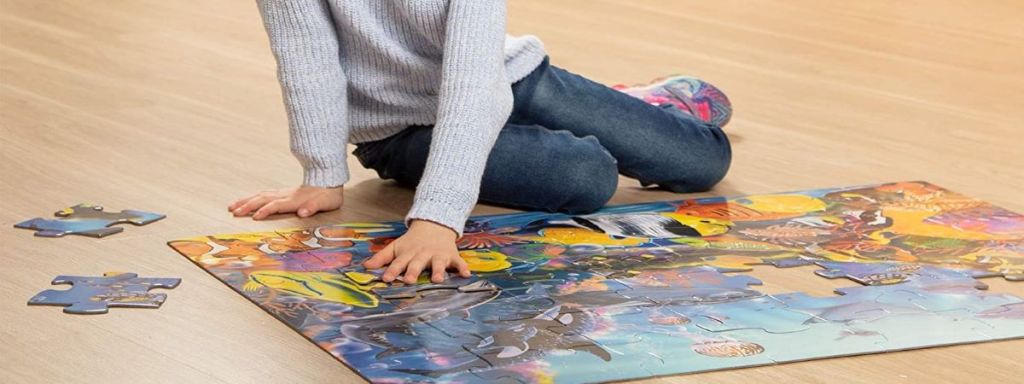 girl putting together a puzzle