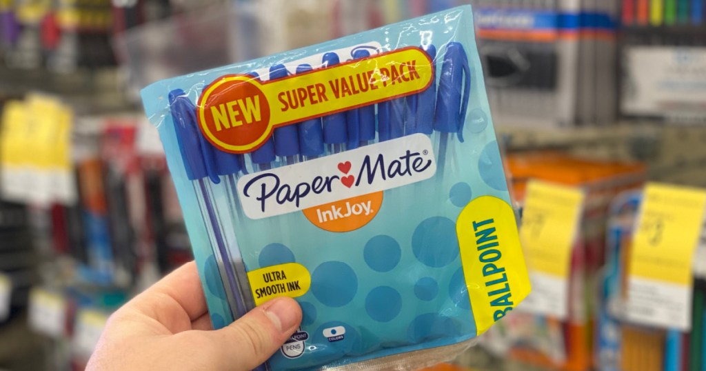 hand holding a pack of pens 