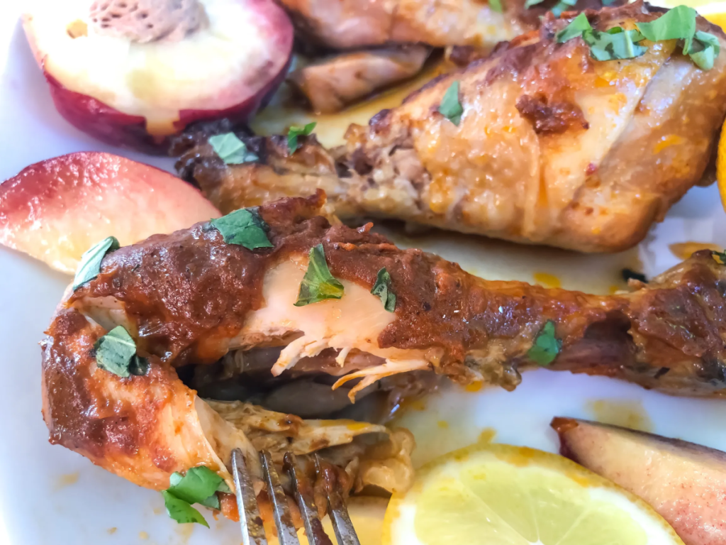 A plate of Peach BBQ Chicken, one of the tasty 2 Ingredient Crock Pot Meals