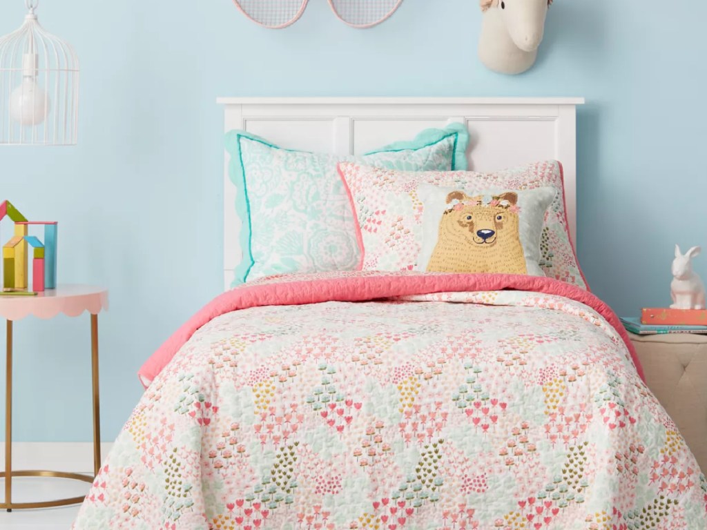 colorful child's room with a bear pillow on the bed