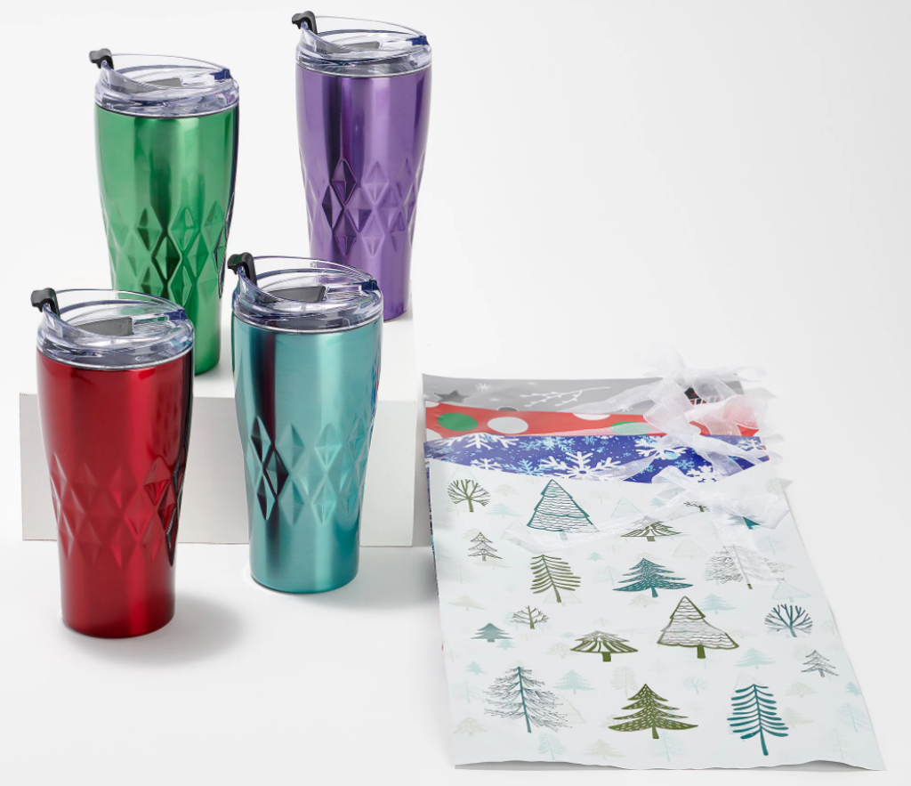 four tumblers next to four gift bags