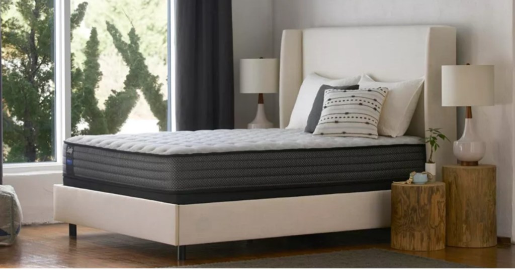 sealy mattress on top of a white box spring in a bed room 