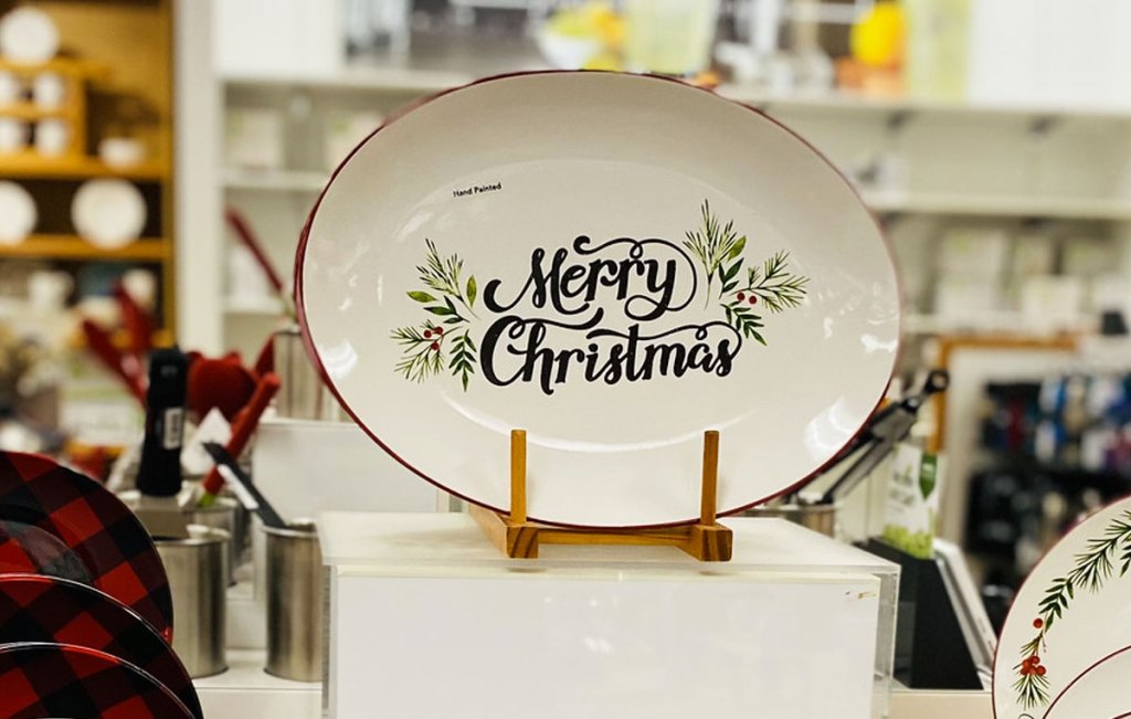 white oval shaped serving patter that says merry christmas