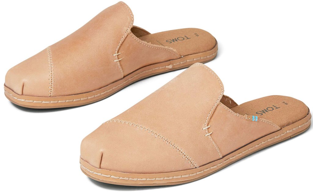 pair of taupe colored leather slip-on mules