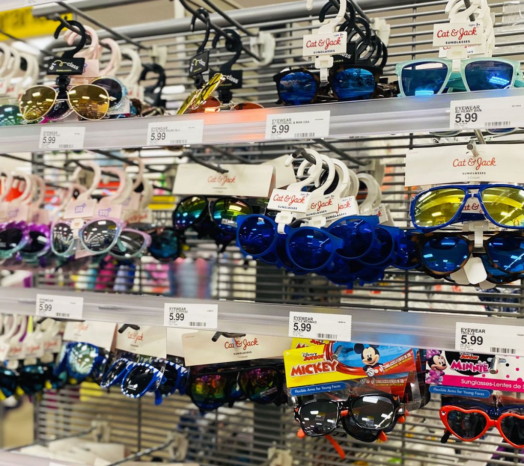 display rack full of various pairs of kids sunglasses at target