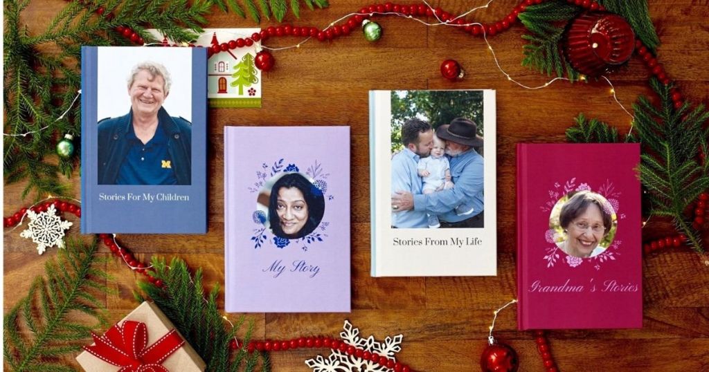 Personalized storbooks on a table next to Christmas decorations