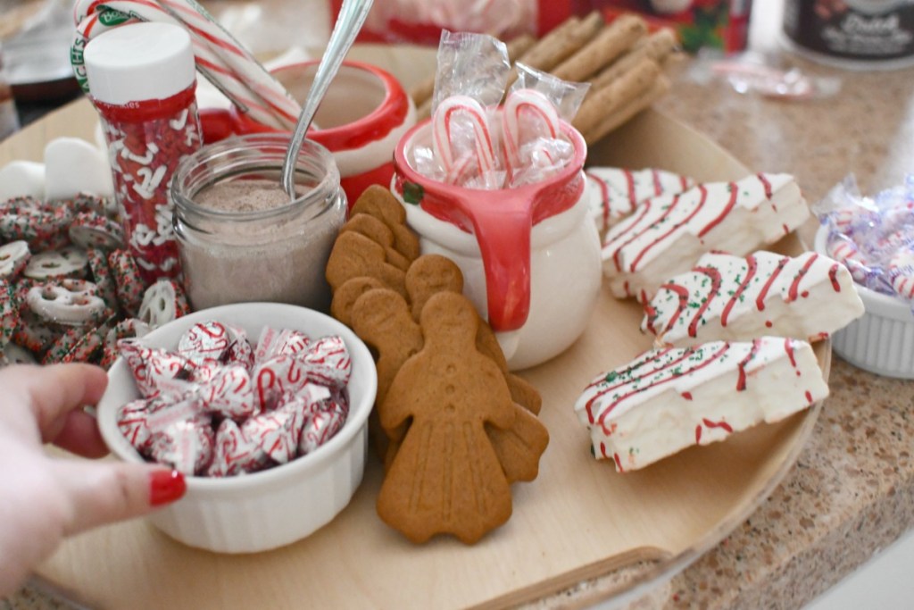 adding candy to hot cocoa charcuterie