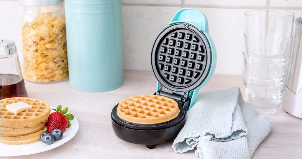 bella mini waffle maker blue with waffle in it