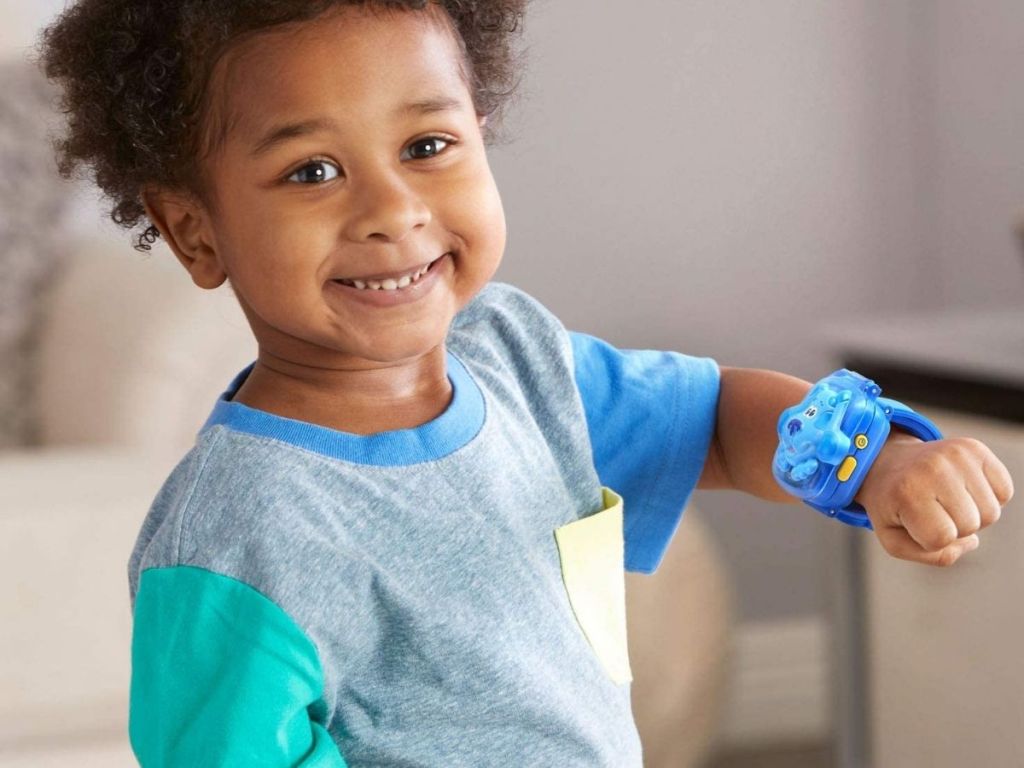 boy wearing blue LeapFrog watch 